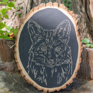 A fox carved into wood.